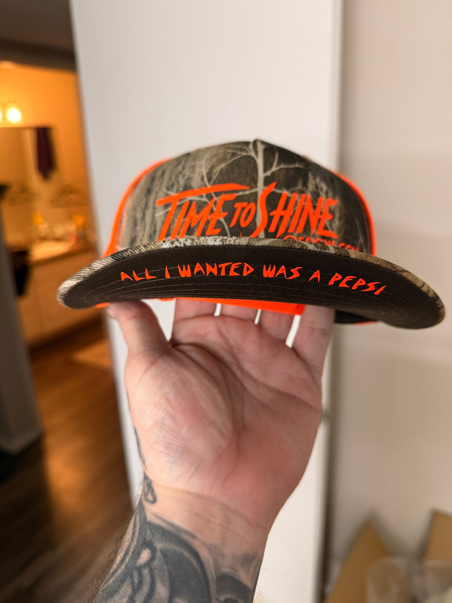 Camo/safety logo Trucker hat