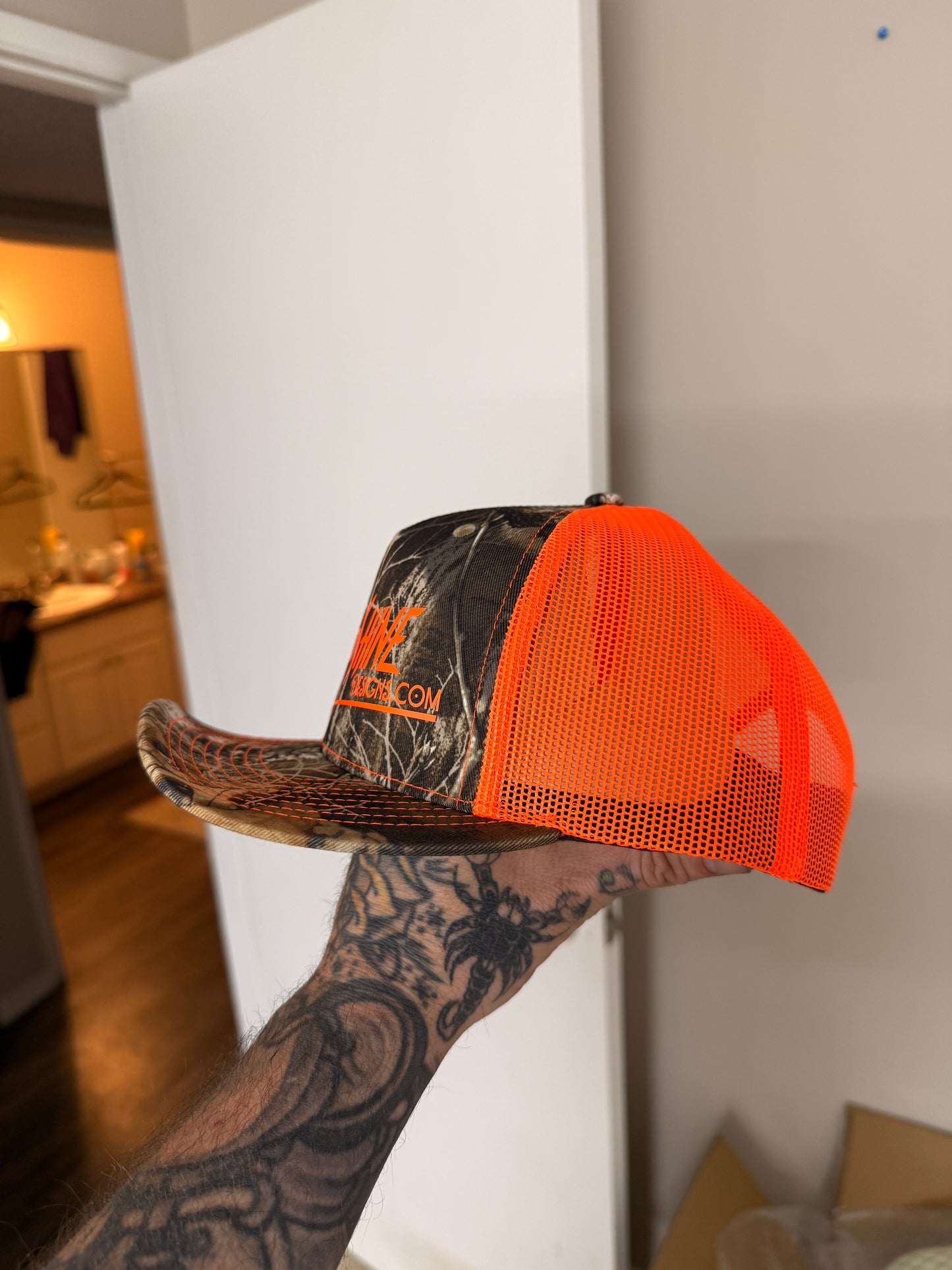 Camo/safety logo Trucker hat