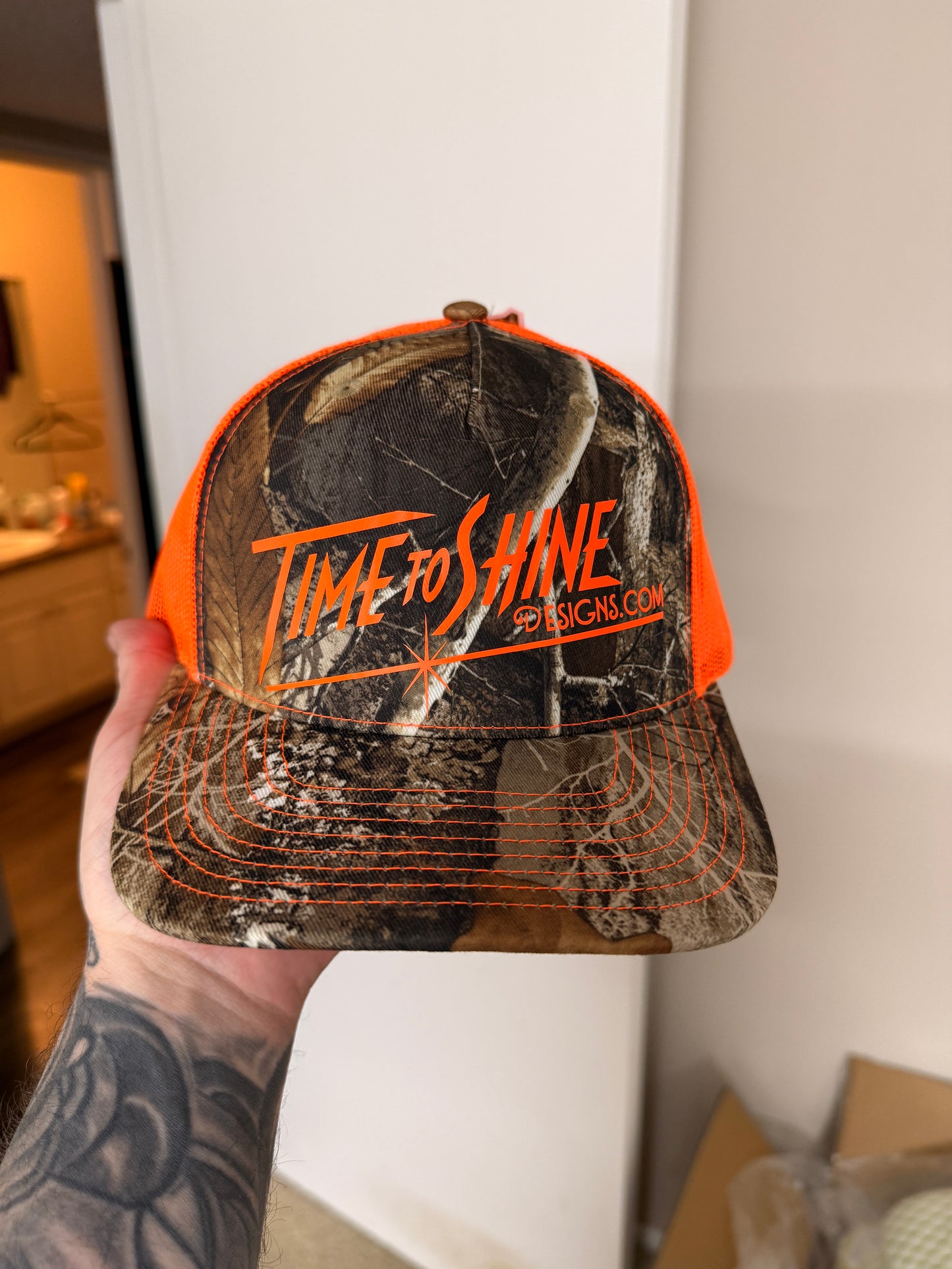 Camo/safety logo Trucker hat