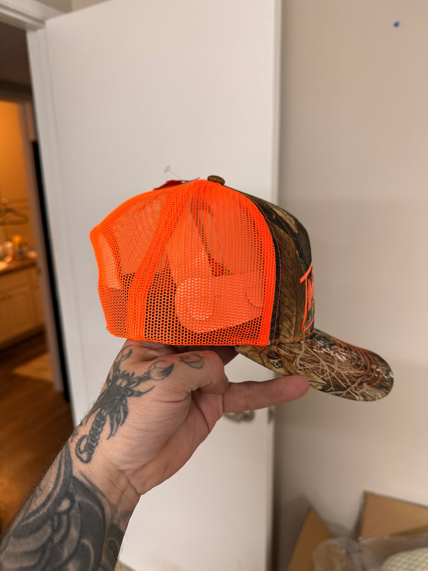 Camo/safety logo Trucker hat